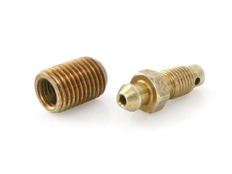 Brass motorcycle brake or fuel fittings, high-quality components for Revelry Cycles.