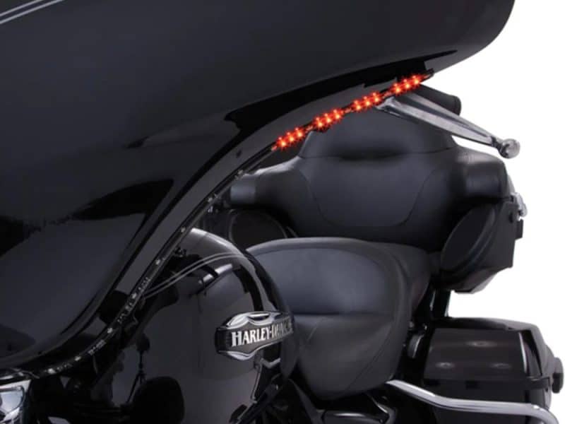 Motorcycle rear lighting with LED brake light strip on black touring Harley Davidson motorcycle.