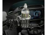 Water bottle holder on motorcycle dashboard, ideal for motorcycle accessories and riding convenience.