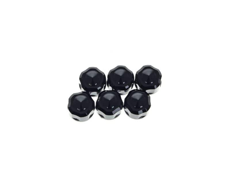 Black motorcycle wheel nuts, durable alloy fasteners for rider safety and customisation.