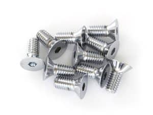 Multiple silver motorcycle screws with flat heads on white background.