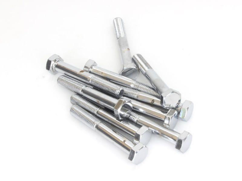 Bolt hardware for motorcycles, shiny chrome finish, part of motorcycle maintenance and repair.