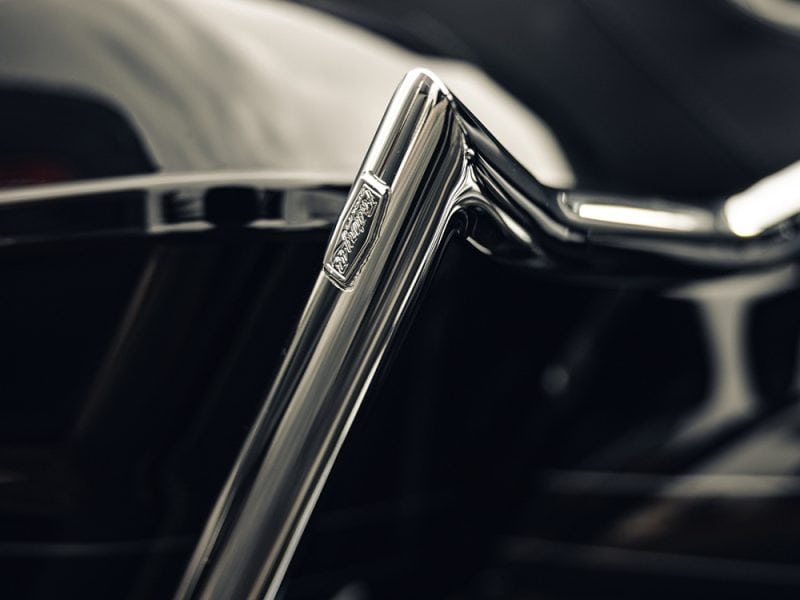 Shiny chrome motorcycle handlebar close-up, highlighting premium design and craftsmanship.