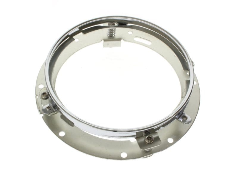 Bright chrome motorcycle headlight ring with mounting screws, compatible with Revelry Motorcycles.