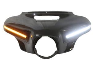 Carbon fibre motorcycle headlight cowl with integrated LED turn signals for Harley Davidson.