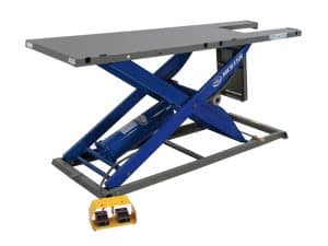 Heavy-duty motorcycle lift table for maintenance and repair at Revelry Motorcycles.