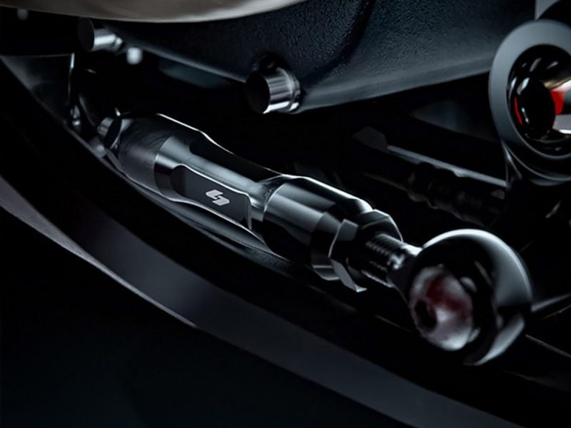 High-performance motorcycle fueling system component, sleek metallic design, part of Revelry Motorcycles accessories collection.