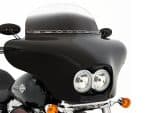 Sleek black Harley-Davidson motorcycle with custom fairing for touring and style.