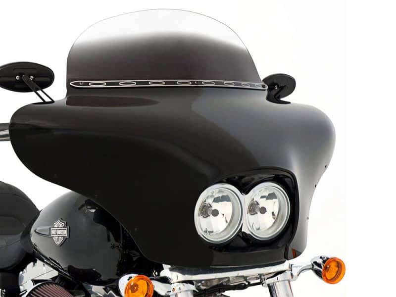 Sleek black Harley-Davidson motorcycle with custom fairing for touring and style.