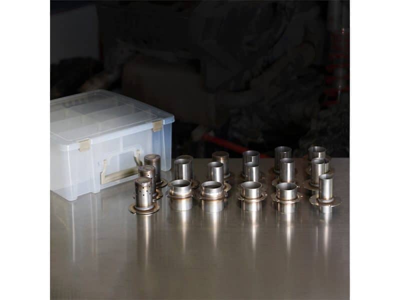 Precision motorcycle parts on a workbench at Revelry Motorcycles in Australia.