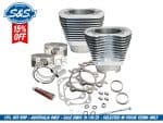 Pistons and gaskets set for motorcycle engine repair.