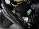 High-performance motorcycle suspension component close-up, showcasing quality engineering for Revelry Motorcycles.