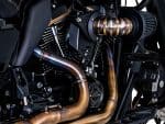 High-performance motorcycle engine with custom exhaust system at Revelry Motorcycles, premium motorcycle accessories, and parts.