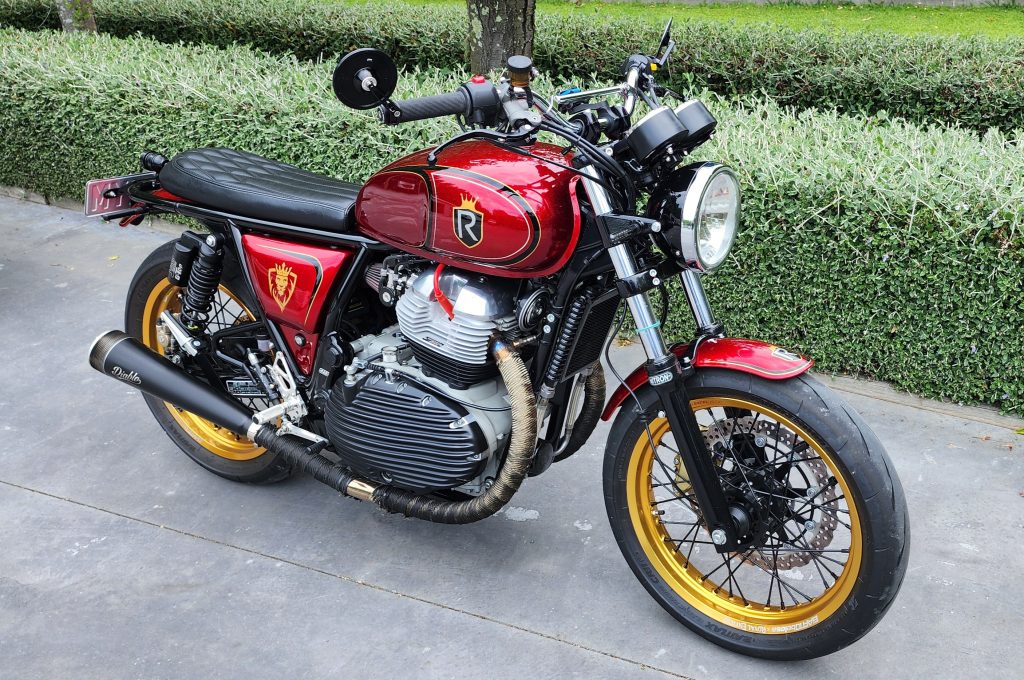 Custom vintage motorcycle with red and gold accents, handcrafted by Revelry Cycles in Australia.