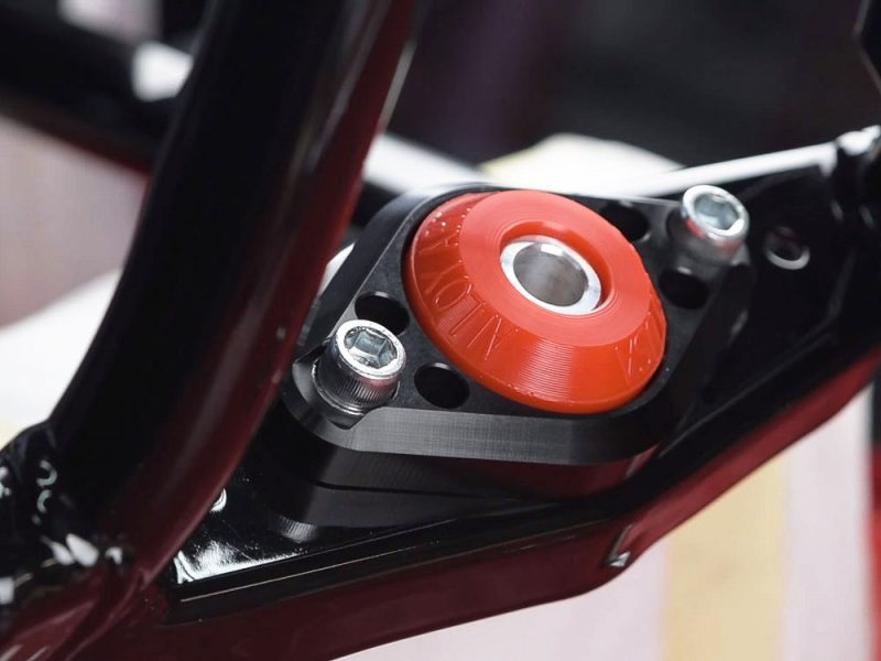 High-performance motorcycle suspension component from Revelry Cycles, showcasing precision engineering.
