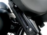 Solid black motorcycle engine part close-up, high-quality custom bike accessories, Revelry Motorcycles Australia.