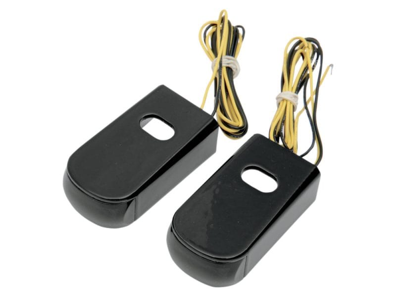 Motorcycle electrical components for Revelry Motorcycles, black plastic housings with wiring harnesses.