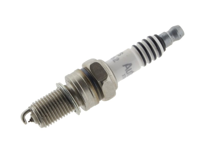 Spark plug for motorcycle engine, high-performance motorcycle ignition component, Revelry Motorcycles Australia.