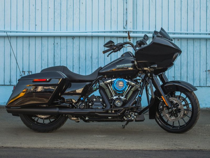 Harley-Davidson touring motorcycle in black with custom blue accents, ideal for long rides and touring.