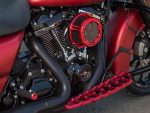 High-performance motorcycle engine with custom red accents and accessories from Revelry Motorcycles in Australia.