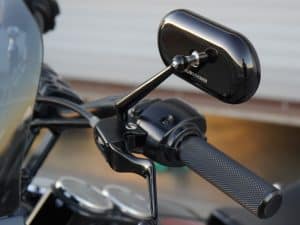 High-performance motorcycle handlebar grip with rearview mirror for Revelry Motorcycles enthusiasts.