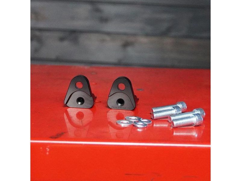Aluminium motorcycle engine mounting brackets with bolts and washers.