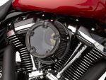 Vivid motorcycle engine with chrome and black details, showcasing high-performance custom revealed Revelry Motorcycles.