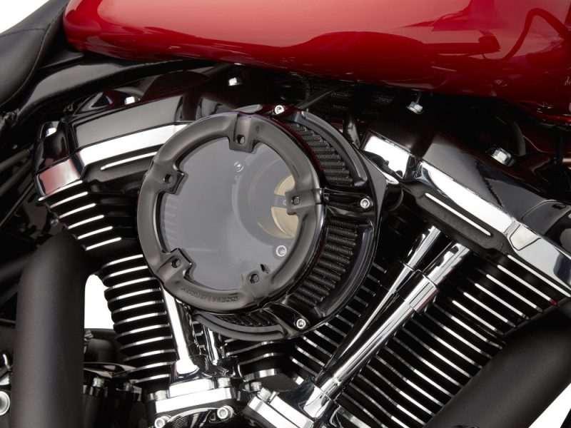 Vivid motorcycle engine with chrome and black details, showcasing high-performance custom revealed Revelry Motorcycles.