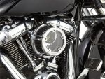 High-performance custom motorcycle engine with chrome finish, showcasing intricate detail and craftsmanship.