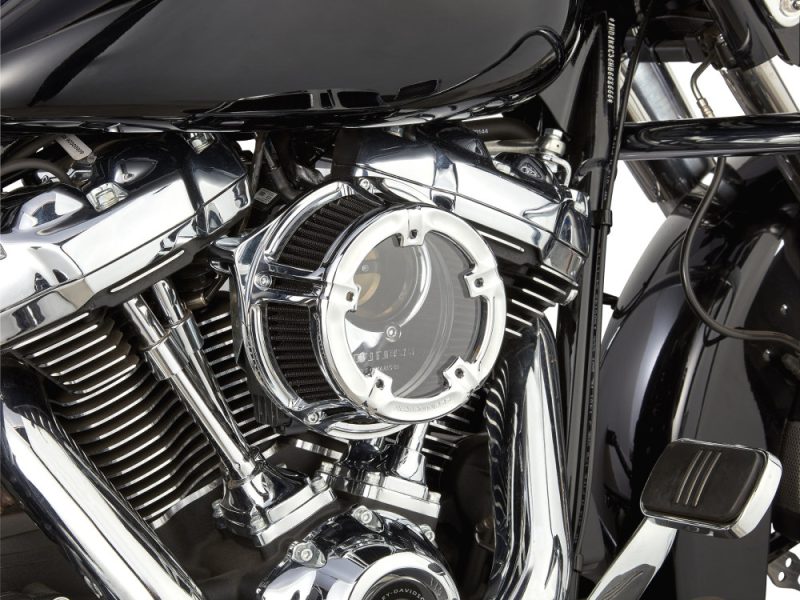 High-performance custom motorcycle engine with chrome finish, showcasing intricate detail and craftsmanship.