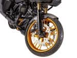 Gold motorcycle wheel and front suspension on a sleek black bike.