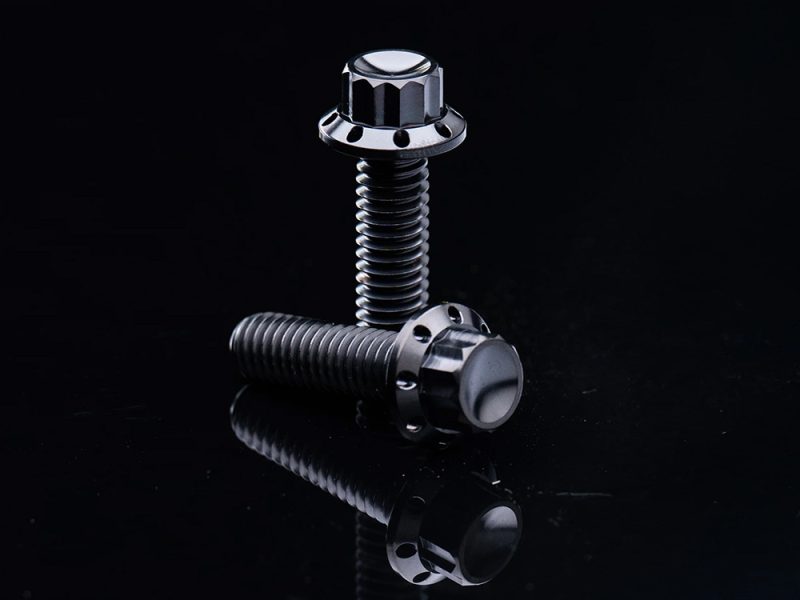 Titanium 12-Point Transmission Side Cover Bolt Kit - Black. Fits Touring 2007-2023 High-quality black motorcycle bolts for Revelry Motorcycles, durable and sleek design.