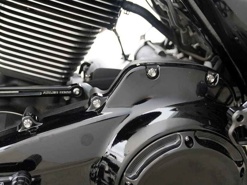High-performance motorcycle engine components with sleek black and metallic finishes.