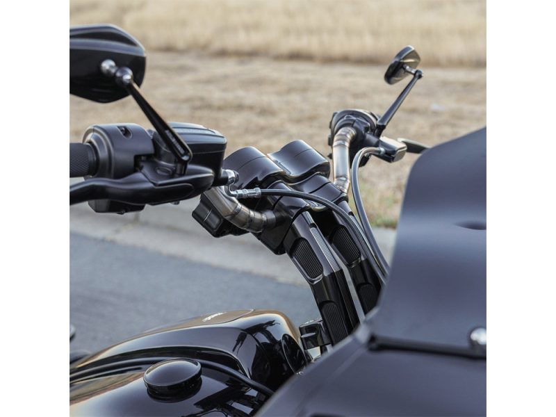 Sleek black motorcycle handlebar and dashboard detail at Revelry Motorcycles, highlighting custom motorcycle craftsmanship.
