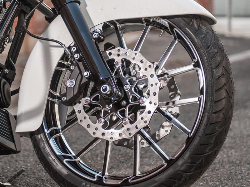 High-performance motorcycle front wheel with disc brake and alloy rim, ideal for custom and cruiser bikes.