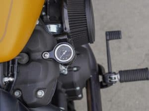 High-performance motorcycle oil pressure gauge on Revelry Motorcycles custom bike in Australia.