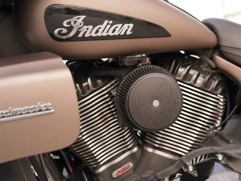 V-twin motorcycle engine with Indian branding, highlighting motorcycle engine features and design.