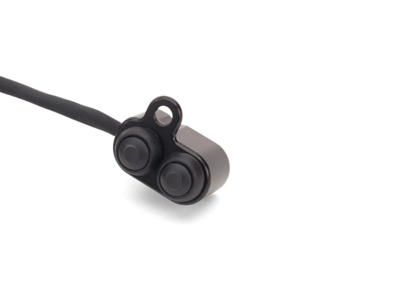 Wireless motorcycle communication earphone, sleek black design for riders and passengers.