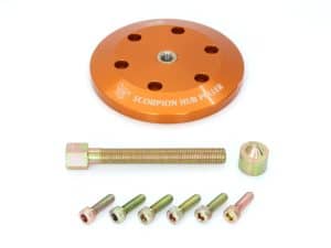Bright orange motorcycle hub puller for Revelry Motorcycles.