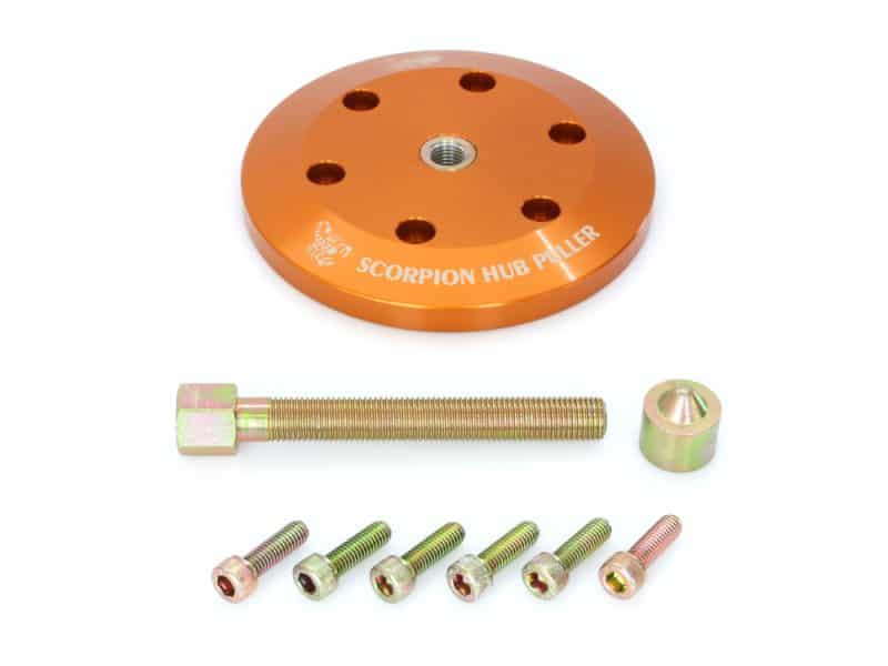 Bright orange motorcycle hub puller for Revelry Motorcycles.