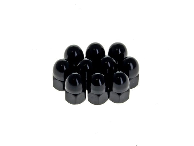 Black motorcycle axle nut covers on white background.