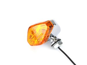 Bright orange motorcycle indicator light for Revelry Motorcycles safety and visibility.