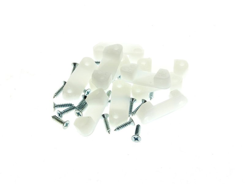 White plastic screw spacers for motorcycle repairs or customisation.