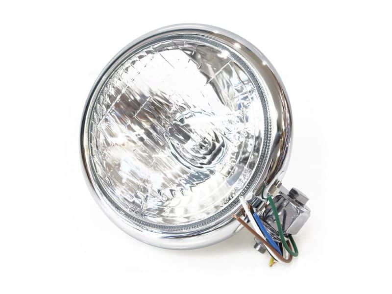 Bright motorcycle headlight with chrome finish for Revelry Motorcycles custom bikes.