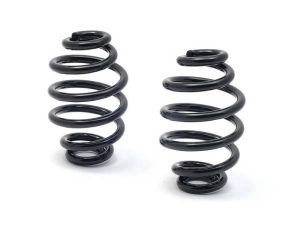 Black motorcycle suspension coil springs for Revelry Motorcycles, high-performance parts for bike comfort.
