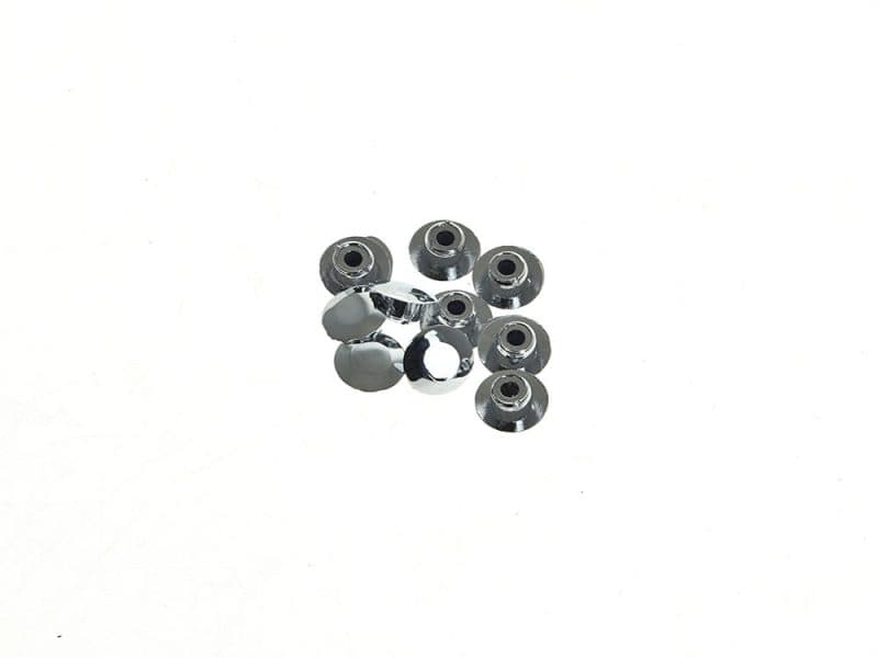 Shiny chrome motorcycle axle nut spacers for custom bike builds.