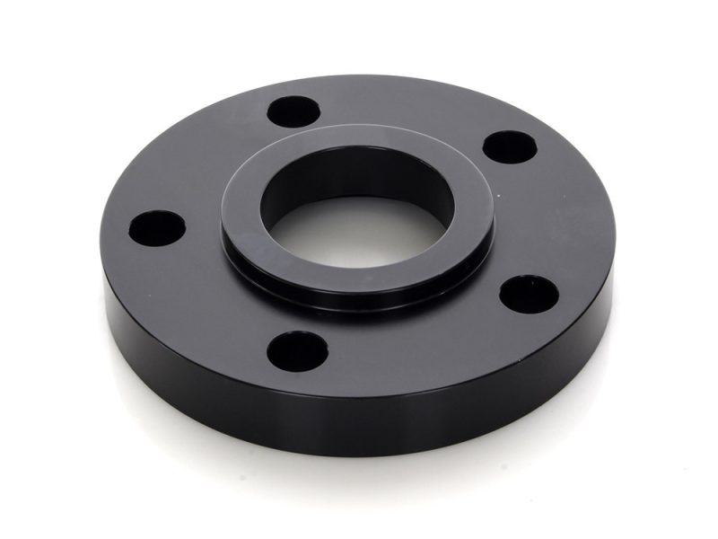 Black motorcycle wheel spacer for custom bikes and repairs.