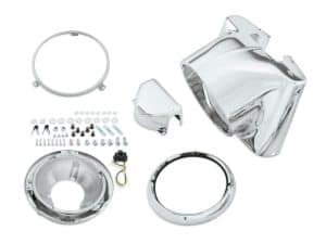 Shiny chrome motorcycle headlight and headlamp mounting kit components.