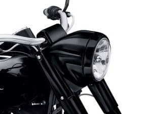 Vivid black motorcycle headlight with chrome accents, perfect for riding enthusiasts.