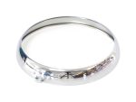 Shiny chrome motorcycle headlight bezel for vintage bike styling.